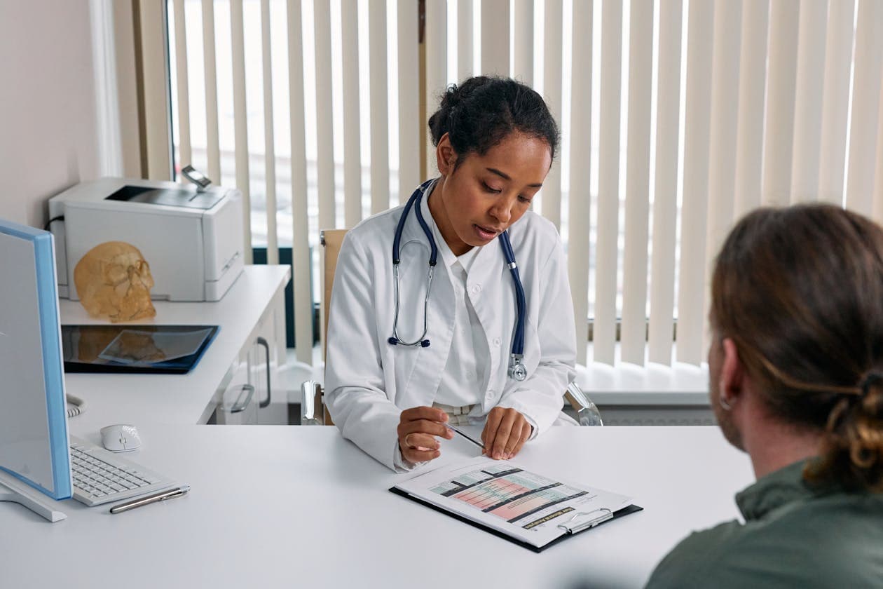 Medical Practice Web Design - Patient Experience First Tampa doctor consulting with patient about healthcare services and online booking